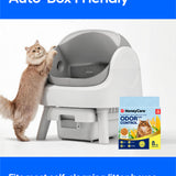 A cat stands on its hind legs beside a white and gray self-cleaning litter box. The image includes marketing text reading 'Auto-Box Friendly' and 'Fits most self-cleaning litter boxes,' plus a HoneyCare OdorControl litter box package shown on the right.