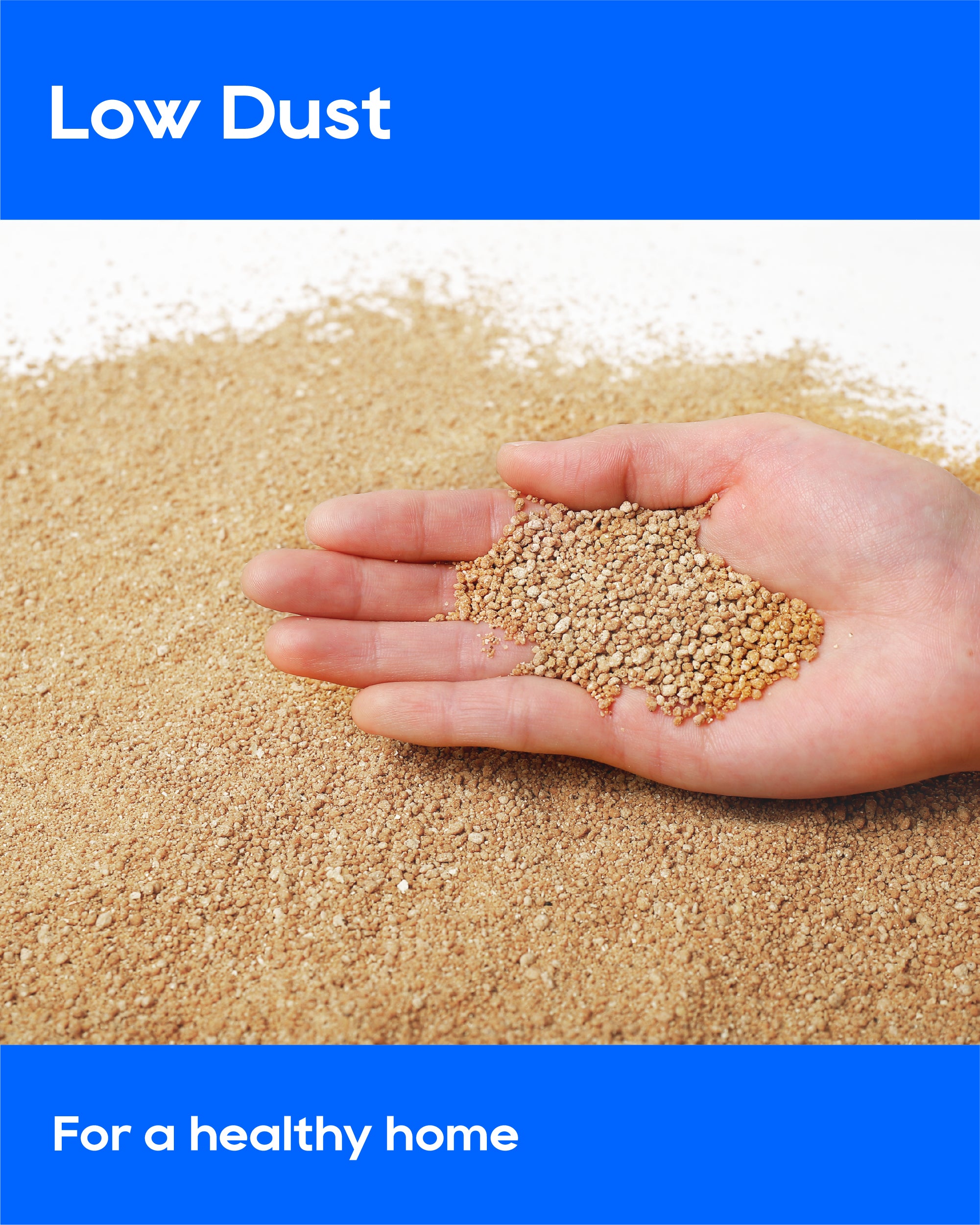A hand holding a small pile of light tan granules over a larger spread of the same granular material, with blue banners reading 'Low Dust' and 'For a healthy home'.